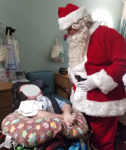 santa-with-patient-250x299.png